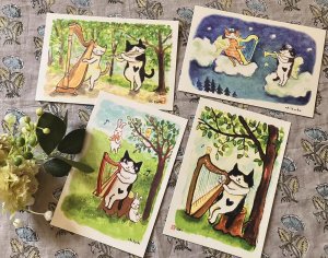 画像1: ドレミかんぱにー：ポストカード4枚セット「ハープ弾きの猫」（全額寄付） (1)